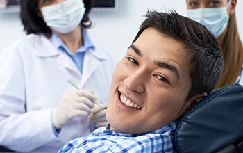 Smiling man in dental chair