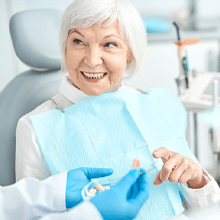 mature woman at consultation with dentist