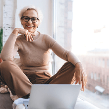 happy mature woman relaxing at home