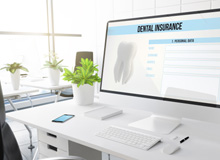 Dental insurance form on large computer monitor
