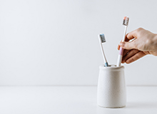 Taking toothbrush out of a holder