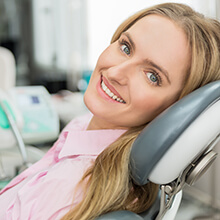 Smiling woman in dental chair