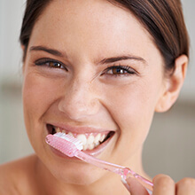 Woman brushing teeth