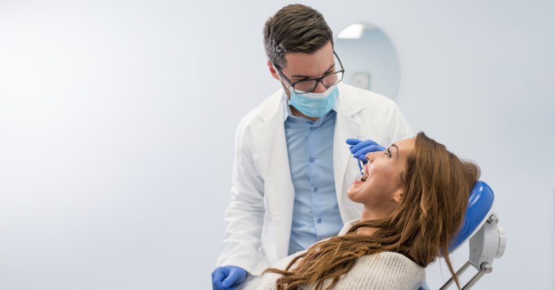 Patient smiling after tooth extractions